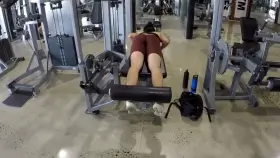 Girl exercises in sexy red gym shorts