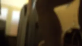 Nude guy in solarium, female staff glances at penis several times.