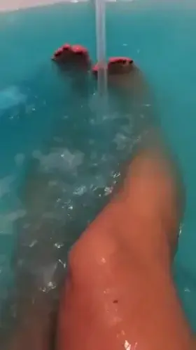 Ava Addams washing her feet and legs