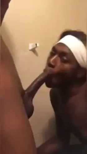 Black sissy slobbering and milking long black dick