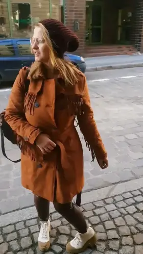 A simple walk around town, a modest girl with glasses.