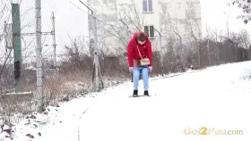Spraying her piss on the snow