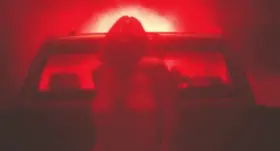 Sydney Sweeney in the back of a truck