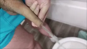 Loud piss through my foreskin