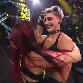 Rhea Ripley giving Io Shirai's ass a few smacks