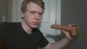 Sucking a huge dildo