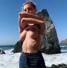 Eva stripping down at the beach