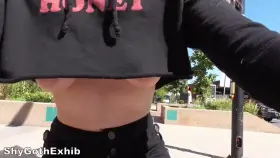 Is upblouse close enough? A girl riding through town braless in a crop top