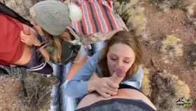 The one in the knit grey cap sucks the guy's balls