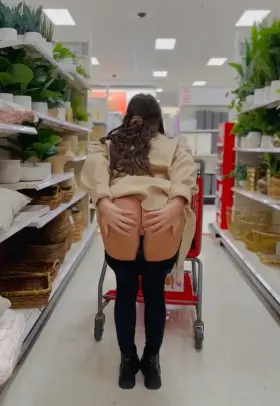 Hotwife spreads cheeks in store