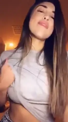 Hot brunette reveals amazing breasts