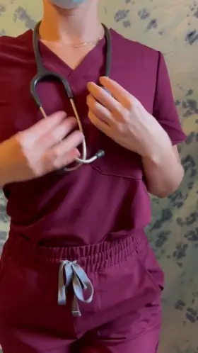 Teasing you with some underboob under my scrubs