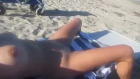 This is how my wife hangs out at the beach. She fans her legs creating wetness and making her pussy swell. She gets very turned on when voyeurs start looking. (F)