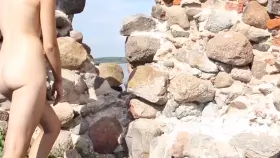 Completely Naked Hiding From Other Tourists Behind The Wall