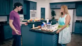 Mom gives me a taste of her special recipe