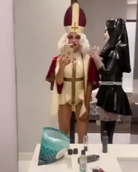 Kate Beckinsale lubing up her latex Nun costume