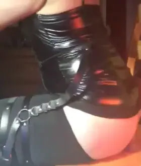 Side POV of riding a cock in leather dress