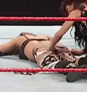 Melina exposing Candice Michelle’s 🍑