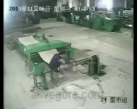 Man stuck in a machine at work. Shoes fly off.