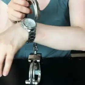 [F] Self-cuffing with heavty handcuffs (GIF)