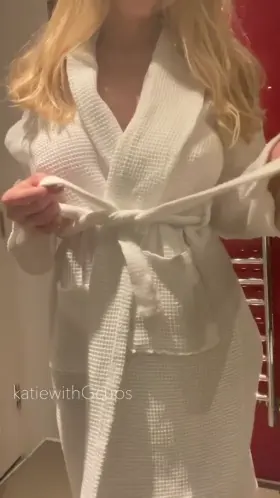 From bathing robe to naked busty blonde!