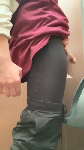 Pissing in the porta potty outside the stadium