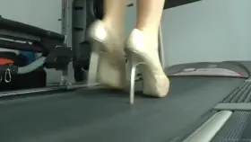 On a treadmill wearing heels and a dirndl
