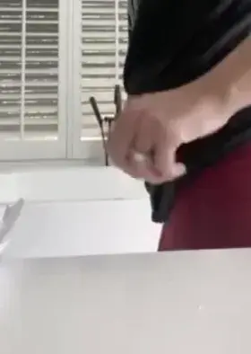 Taking off her yoga pants