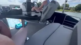 Hubby drives the boat while I blow his friend