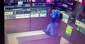 Man lights up cigarette in a store having gas leakage