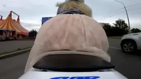 Nice booty in short skirt on a motorcycle