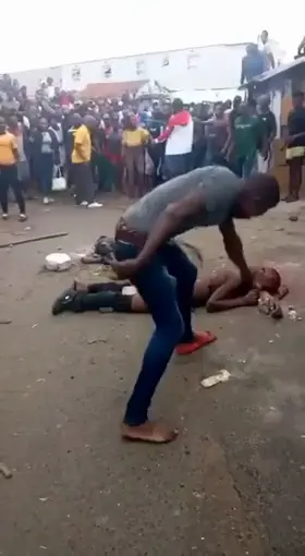 An African man being publicly executed (Probably homosexual)
