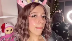 Cosplay girl shows off her reward