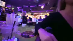 Having some naughty fun at the bar.