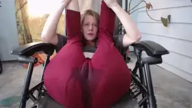 Wetting red yoga pants in a wilderness gynecology chair. ID her?