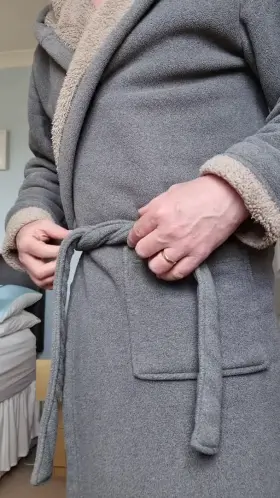 Under the robe in blue briefs!