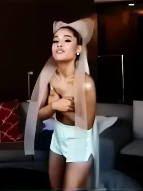 Ariana holding her barely there itty bitty titties