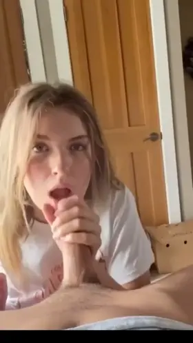 Cute blonde giving him a good BJ