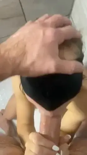 Deep throating a huge 9.5” cock in the shower