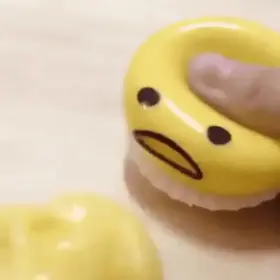 A vomiting egg stress toy.