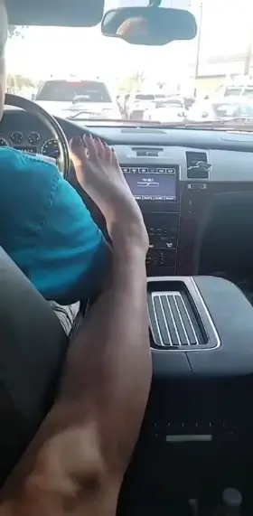 This cruel hotwife makes her hubby kiss her feet while he drives them around and she plays with her bull's bbc in the back seat (short)