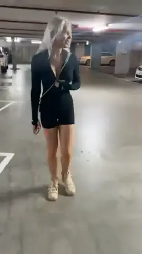 Showing boobs in a parking garage