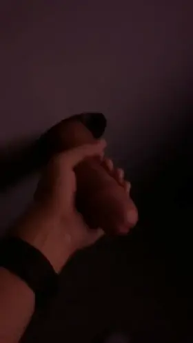 Wanking a huge cock at a gloryhole