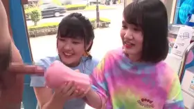 Two women help a man with a Handjob