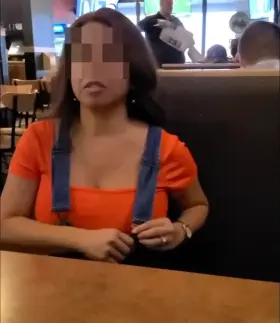 Indian having fun while waiting for food
