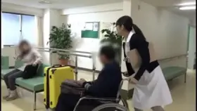 Nurse helps her patient with physiotherapy
