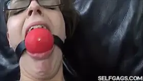Annoyed and hurt by big ball gag