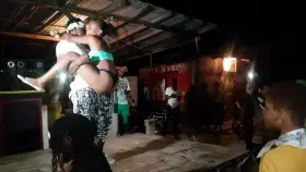 Hottie in a bikini learns some new dance moves on stage