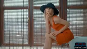 Teen blonde with a great ass and a black hat gets naked