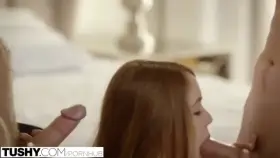 Cute Redhead Kimberly expertly jerking off and sucking 2 cocks